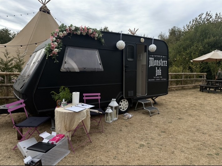 Monsterz Ink mobile tattoo caravan set up at a wedding venue
